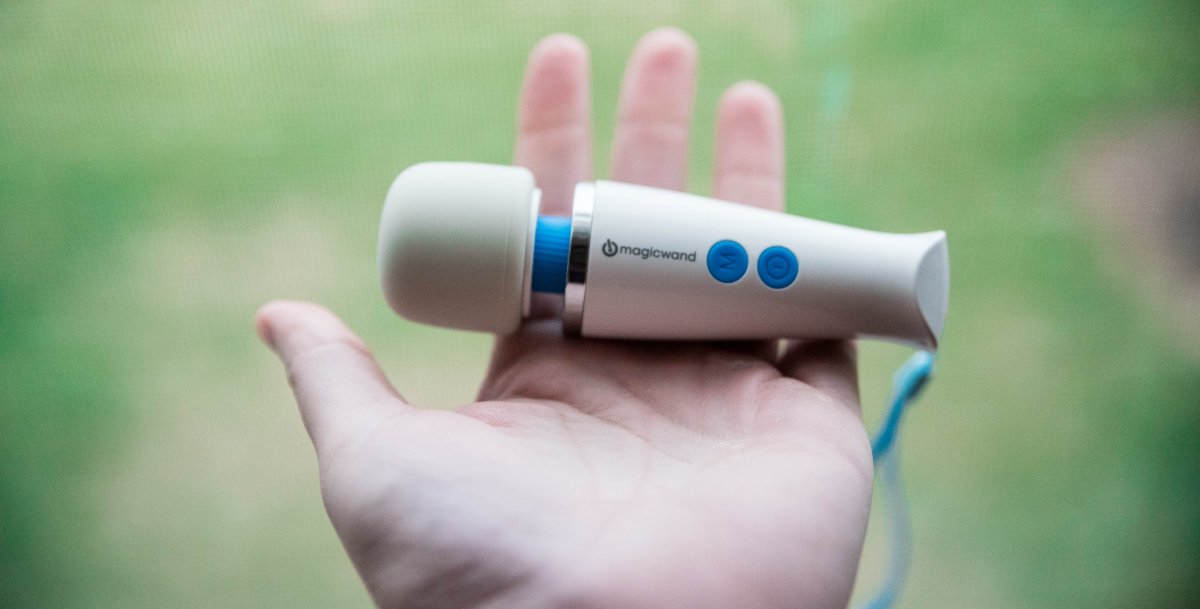 The Vibratex Magic Wand Micro. The toy has a white silicone head and a long white handle with two blue buttons.