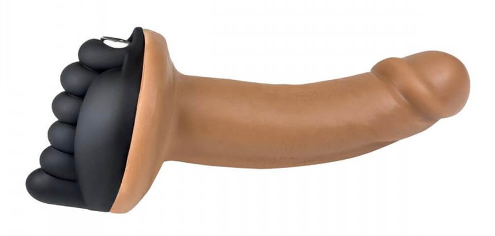 The Honeybunch: A black silicone toy attached to the base of a realistic dildo. The black toy is oval-shaped with vertically aligned bumps down the center, facing away from the dildo, to provide clitoral stimulation for a clitoris-owning wearer.