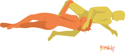 Peepshow Oral Sex Position: The receiving partner lies on their side holding the giving partner's head between their legs to receive oral sex. The giving partner is laying on their side facing towards the receiving partner.