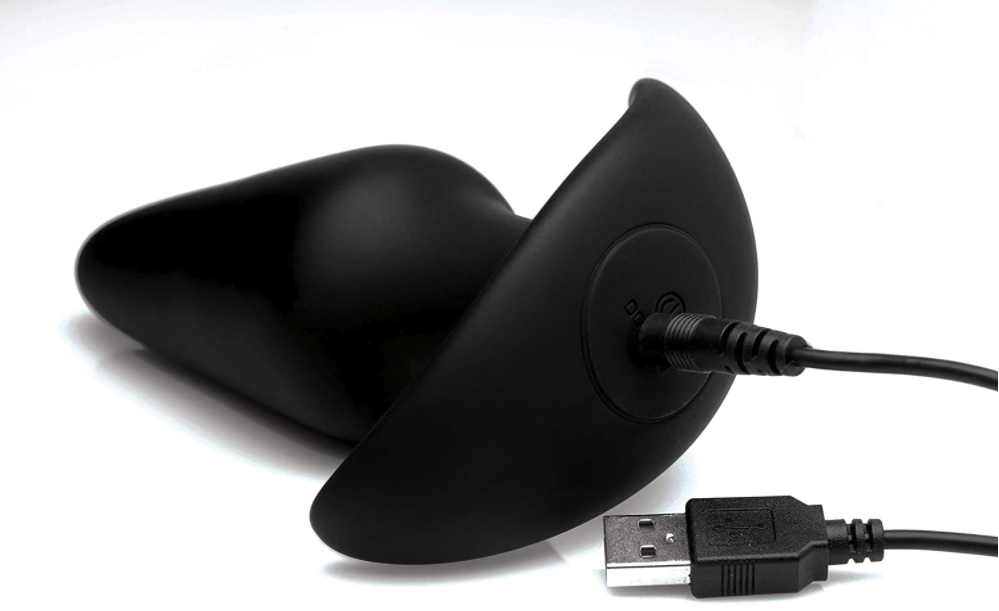 XR Thump-It! Large Thumping Plug butt plug plugged in to USB charging cable